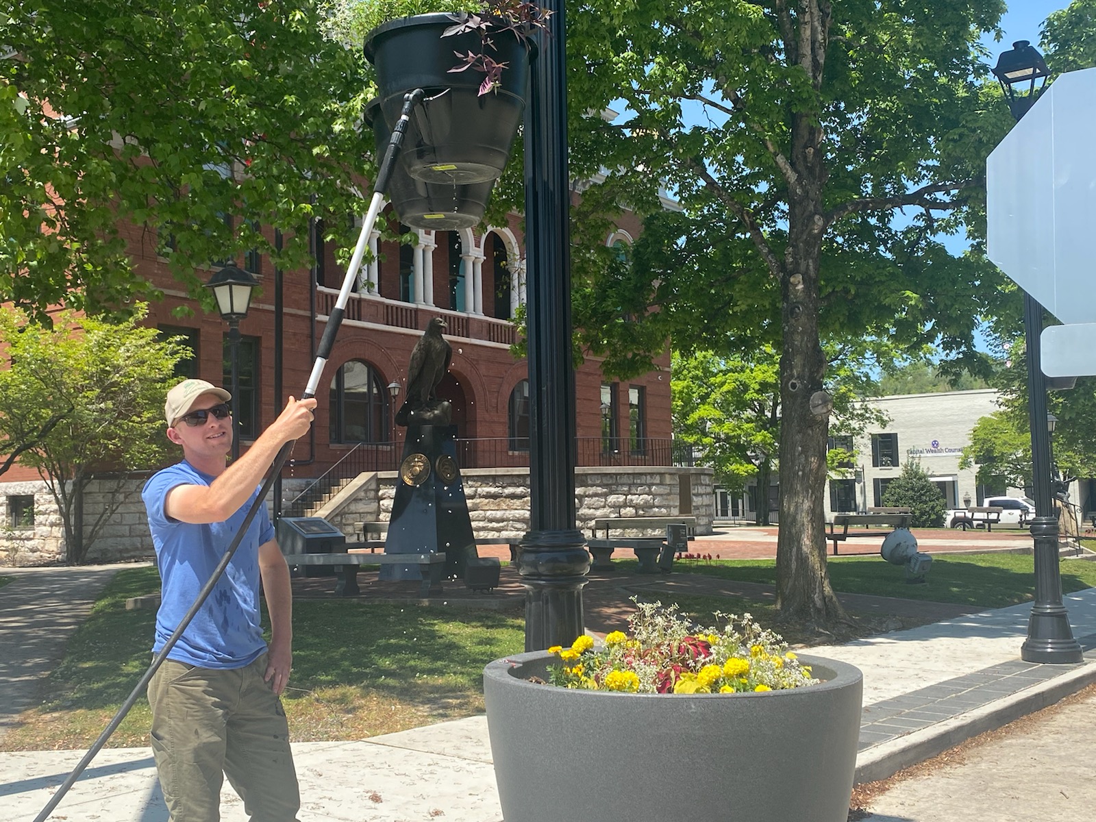 parks and rec watering plants downtown 04 2021